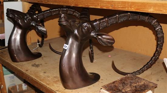 A pair of bronze stands modelled as antelope heads(-)